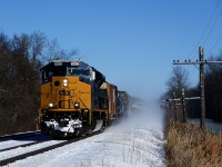 A single SD70ACe-T4 is powering CN 327 as it approaches Coteau where it will set off cars.