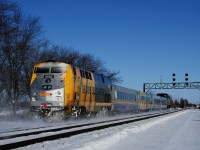 Class leader VIA 900 brings up the rear of VIA 62 as it approaches a vintage signal bridge. It is showing a Medium to Clear signal for VIA 62, which will bring it to the South Track, with CN 149 coming on the North Track.