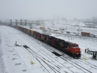 The outbound crew is getting out of the taxi just after CN 305 arrived at Turcot Ouest in the midst of a snowstorm.