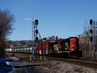 GP9s CN 7060 & CN 4140 are leading about thirty cars that had been parked towards Pointe St-Charles Yard, including a cut of GWRS hoppers in the green Saskatchewan paint scheme.