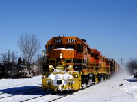 SLR 393 has left the Sherbrooke Sub and is now on the St-Hyacinthe Sub as it approaches St-Hyacinthe Station with four EMDs (SLR 3047, RLHH 3043, SLR 3007 & QGRy 6904) and 42 cars.