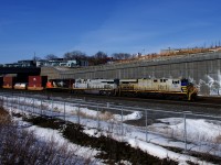 The two ex-CREX units on the head end of CN 120 (CN 3939 & CN 3948) have different shades of grey as they approach Turcot Ouest, with CN 9418 as the third unit.