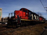 After running around their train, GP9s CN 4140 & CN 7060 are about to shove off of the East Side Canal Bank Spur. At left is the Atwater Market, which opened in 1933 and is still in use by numerous bakeries, restaurants and butchers. 