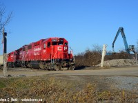 <a href=http://www.railpictures.ca/?attachment_id=48548 target=_blank>Rust never sleeps</a> in Hamilton as scrap metal dealer Triple M. Metal (Hamilton Parkdale, one  of three sites in the Hammer) sorts ferrous (Iron Oxide covered) scrap with a magnetic loader to load into rail cars. A CP Kinnear yard job is up in the north end in nice morning light as they bring empties for AIM (American Iron and Metal). I worked in the building just out of sight across the tracks at Right, back in the late 1990's when Philip Services cornered the metal trading and scrap metal market in Hamilton. I had to visit all the sites in Hamilton (Upgrading DOS computers to Windows 95/MS Office 97 to Office 98 and Oracle client installs) and they were all over the place near rail yards and I loved it. Even watched CP trains from HQ (Stelco building, 25th floor) rolling through downtown Hamilton as they passed by. Philip Services went under in a blaze of financial glory (Share price when I started - $27. When  I left - $4 and that was only four months later) and now many other companies have rolled in to handle the growing Scrap business in Hamilton. Most of the scrap metal goes out by rail.