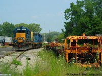 This is a rare photo for me, because in the few months that I followed the CSX Sarnia to Chatham turn this was the only time I arrived to find power actually sitting in Chatham already waiting for a D724 to Blenheim. Usually the power would be carried in the morning by D725 for a 1400 order time. Parked in the small yard that was located where the "roundhouse" (as they called it) was - it was a four stall engine house and between the roundhouse and this track was the mainline. Across a bridge in the distance was the station area and CP diamond, behind me is the CN diamond. After quickly exploring Chatham I went to the station where the clerk invited me in to cool off - it was *hot*. <br><br>
This was the place that time truly forgot - and Chatham truly manifested it - not only did CSX call out of here twice a week, there were three vehicles parked at the "roundhouse" for what? I don't know, but there were friendly CSX employees everywhere and now you'd be lucky to find two or three folks on duty up in Sarnia per shift. CP also had a yard job a few times a week out of Chatham, plus a very busy mainline, and not to mention CN's locals and pair of mainline trains at the time. A far cry from what goes on now. Add to it the copious amounts of visible MOW equipment that i'm sure <a href=http://www.railpictures.ca/author/poshell target=_blank>Paul O'shell</a> will enjoy (all of it had Chessie markings too, and still does to this day many of which you can still find in Sarnia). <a href=http://www.railpictures.ca/?attachment_id=13162 target=_blank>Here is  Geoff Elliott's shot from the same day</a> as this was when I met him with his crew :)