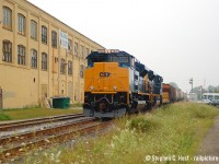 GEXR 431 passing the Boehmer Box building near downtown Kitchener while traffic waits to cross including a GRT bus on Duke St. The power was the attraction, and you pretty much had a pair of these almost daily for a few months while they were being tested by EMD on GEXR 431/2. All of these are off the CSX roster but I believe a few are leased to some of the iron ore road(s) up in Labrador/Quebec.