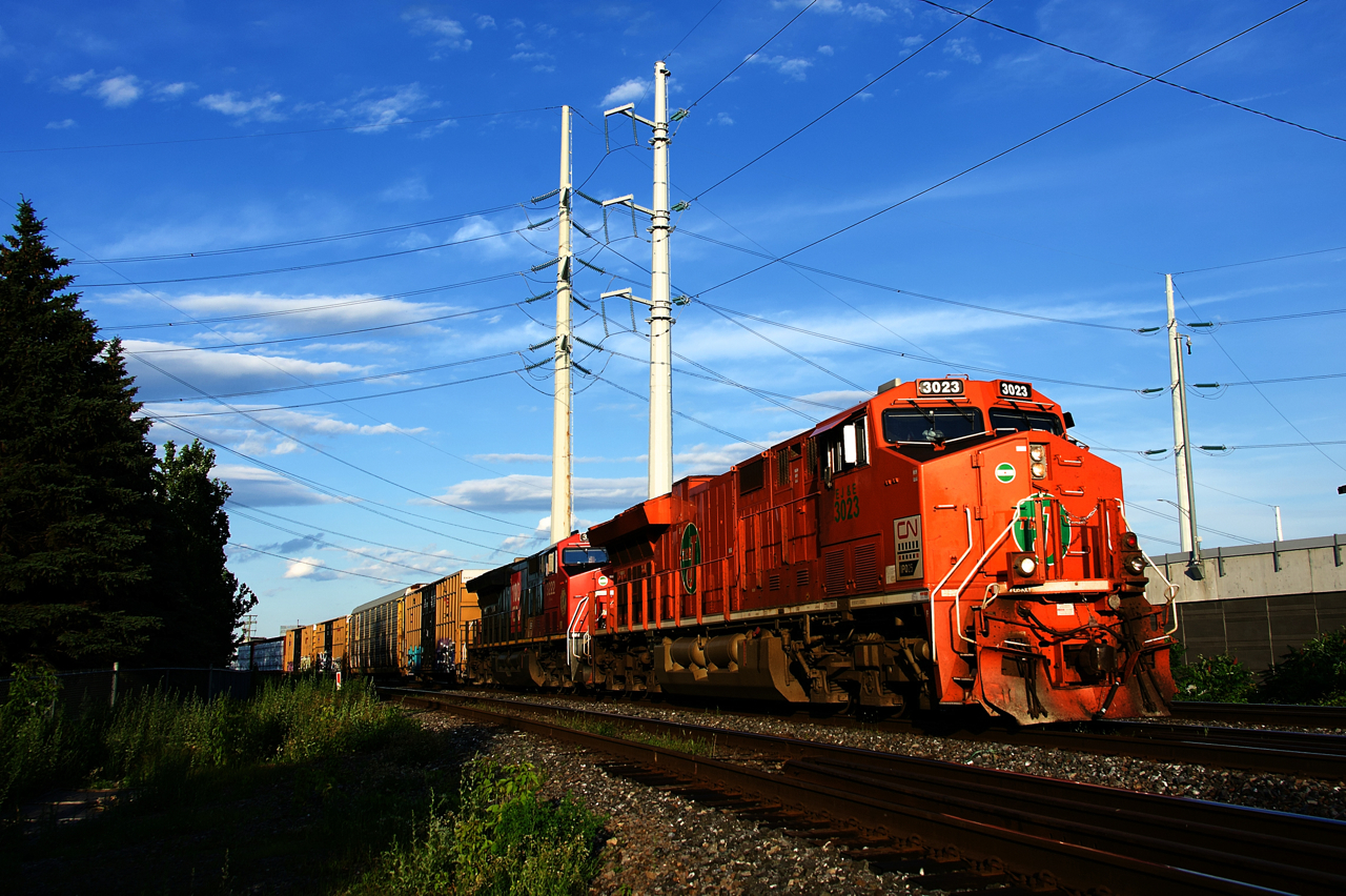 After holding for VIA 39 (for the second time on its run), CN 401 is on the move with EJE heritage unit CN 3023 & CN 3222 for power.