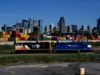 After dropping off grain cars in the Pointe St-Charles yard, CN 9523 & ex-GMTX CN 4904 are heading west light power.