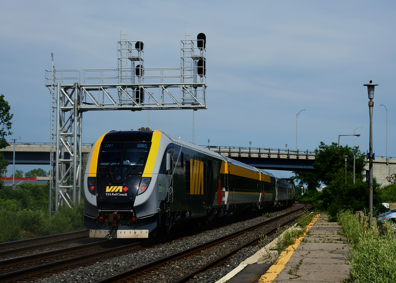 After testing at the National Research Council Canada facilities in Ottawa for over two months, part of VIA Rail's new Siemens Charger set is heading back towards the Montreal Maintenance Centre. It is blasting through Dorval with a Siemens Charger locomotive bringing up the rear.