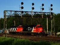 CN 536 is on its way to help CN 321 with a set off and lift as it passes under a signal bridge at Coteau Jct. Power is GTW 6226 & CN 9410.