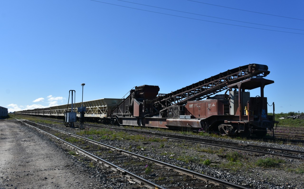 Well, it just wouldn't be me if I didn't sneak in a Work Equipment image among all those uncharacteristic (for me) station photos I've been posting the last few weeks. :-)
GREX 2700 was one of two GREX Dump Trains (GREX 2400 being the other) working out of HBR's Churchill, MB yard each day I was in the northern Manitoba town. Train after train of crushed material left the yard each morning to be dumped along the right-of-way south of town. On my trip into and out of Churchill on VIA 693 & 692, I noticed several Harsco MK IV tampers and Knox Kershaw ballast regulators surfacing track that had been flooded with fresh crushed ballast. The wye at Churchill South was having new rail installed, and a bulkhead flat (UCRY 873032) of new track ties was being unloaded in the yard at Churchill as well. There was no shortage of manpower, vehicles, or equipment (both HBR & contractors) in Churchill, which made it quite clear there was a tremendous effort being made to rehabilitate and upgrade this portion of the HBR's Herchmer Subdivision. While it was interesting and exciting to see all the equipment and work going on, I was also quite content to be on the retired side of my railroad career.