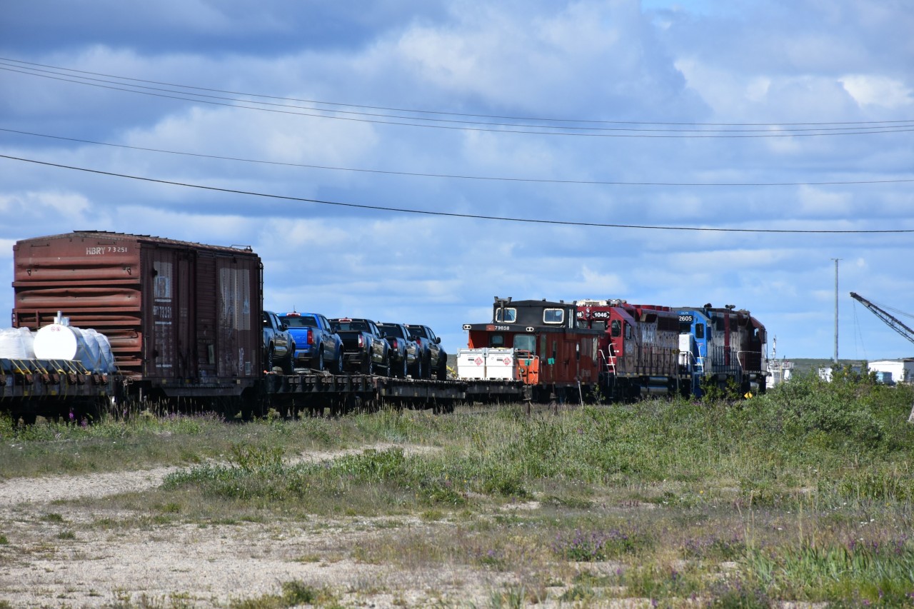 Fresh in from Gillam, MB the HBRY wayfreight has changed crews and begins the busy job of sorting the various loads and spotting them in the yard for unloading. Ex-CN 79858 van is tucked in next to the power and right next to a couple of containers tagged with DOT Placard 1863 Fuel, Aviation, Turbine Engine. It looks like five lucky folks will be claiming their brand new pickup trucks in a few short hours. Other loads ranged from a United Rentals JCB 510-56 Telehandler, a flatcar loaded with pre-formed rebar rods, and several boxcars with unknown cargo. Several of the boxcars were ex-CN double-deck auto tranporters with 9' end doors. (I'll attempt to post a shot of these soon.) Another interesting day of photography in and around Churchill. ????