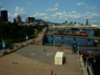 Battered zebras CN 4787 & CN 4724 lead a short transfer out of the Port of Montreal. In the background is the boat <i>Evans Spirit</i>.