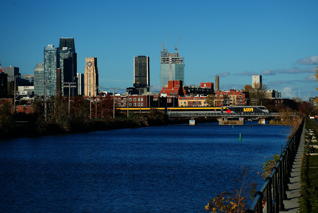 After making a run from Central Station to Ottawa with VIA employees onboard, VIA 628 is on its way back as it crosses the Lachine Canal on an unusually warm afternoon. Charger SIIX 2301 leads the train; one of two Siemens consists that VIA Rail has taken delivery of so far. They are supposed to receive 32 consists once the deliveries are complete.