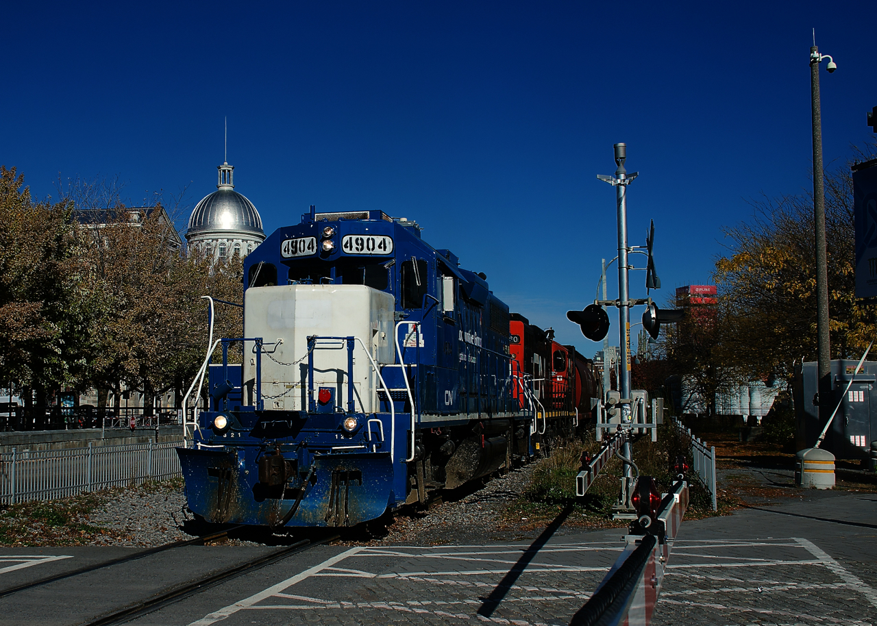 CN 4904 & CN 7060 are leading a long transfer out of the Port of Montreal as it passes the Bonsecours Market.