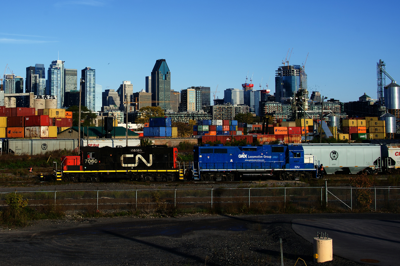 CN 7060 & CN 4904 are running around a cut of grain cars before bringing them to a nearby client.