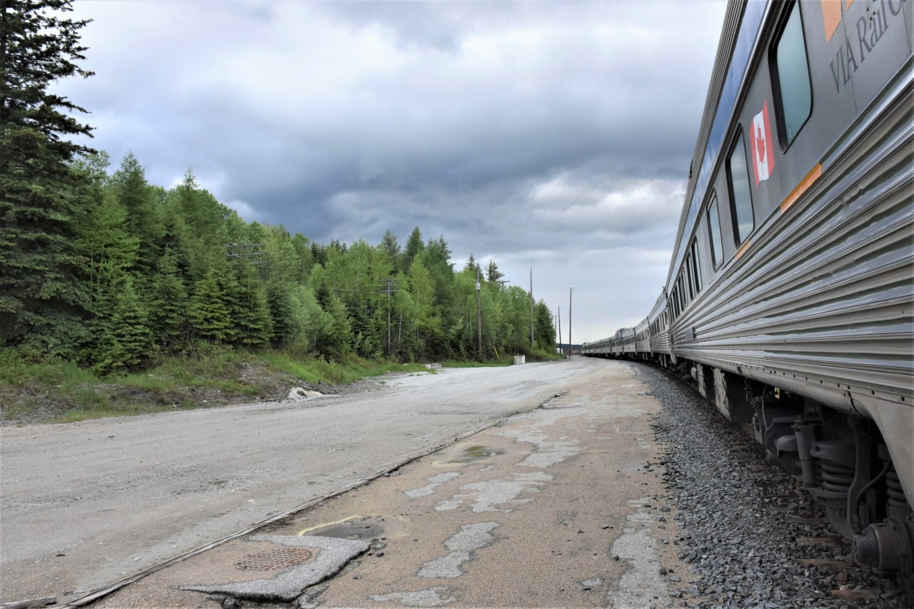 There it is .... gone!

June 9, 2022 at 18:20 hrs., I have detrained from VIA #2 and am walking the station platform area at Hornepayne, ON, but there's no station! 

27 months to the day prior to this photo, I snapped what was to be my final pic of the grand Hornepayne station/Division office building on March 9, 2020.

http://www.railpictures.ca/?attachment_id=40570

I also captured Hornepayne station on December 18, 2001 while working in the yard with some new snow clearing equipment.

http://www.railpictures.ca/?attachment_id=20428

Lots of memories of that building as my Dad's office was on the second floor when he was the CN Roadmaster out of Hornepayne in the early 1960's. As a young kid going to grade school in Hornepayne, I also recall numerous visits to the dispatching office and marveling at all the switches and coloured lights on the subdivision panels. Little did I know at that time, I would end up working at CN and return in the decades ahead to work in Hornepayne, and both east & west on the Ruel & Caramat Subs. on numerous Engineering Dept. projects. :-)