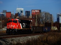 Only in use a bit over a week since being released into service after being rebuilt, gleaming CN 3301 leads CN 305 past the skyline of downtown Montreal. CN 3301 was formerly Dash9-44CW CN 2591 and was rebuilt into a AC44C6M at Wabtec's Fort Worth plant. 