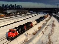 The sun stays out just long enough to get a well-lit shot of CN 305 passing the skyline of downtwon Montreal with class leader CN 3300 leading. CN 3300 was rebuilt from Dash9 CN 2641 and has been in service a bit under two months now.