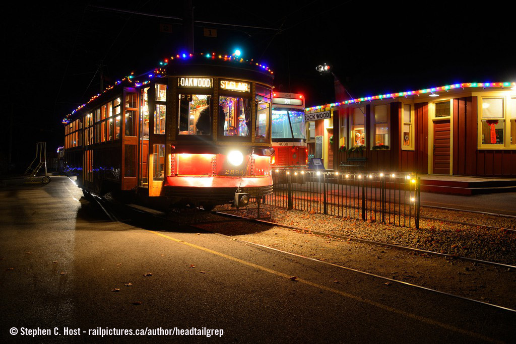 At the beautifully restored Rockwood CNR station at the Halton Country Radial Railway, two cars wait to board/disembark passengers at night during their "Christmas on the Rails" event which only happens for 5 days, the last day being today. They're open until 8 PM and not too late to head over, tickets are always available and trains depart about every 10 minutes with usually two waiting to depart at any given time. Santa is also riding one train most of the night until they close as you can see hereThey generally bring out about 5 or 6 pieces of equipment throughout the day and have about three or four operating at night all lit up with Christmas lights. This will be the last public operating day for some months as the HCRY des not seem to operate over the Winter as it is harsh on the equipment and volunteers :)