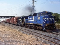 NS 328 with Ex CR C40-8W 8360 and NS GP38-2 5177 through Merritton in 2001.