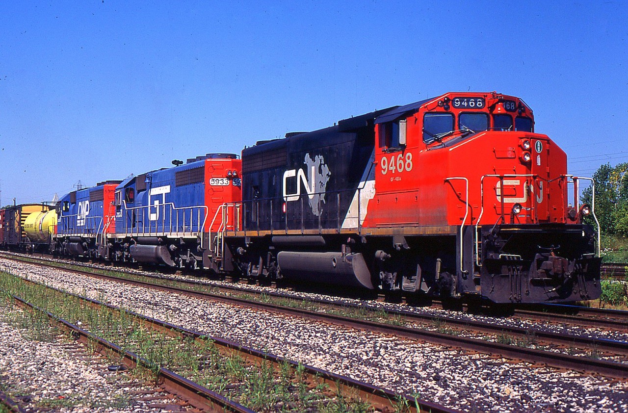 335 had great lashup with CN GP40-2(w) 9468, GTW SD40-2 5933, and DWP SD40-2 5908 through Merritton on the CN Grimsby Sub back in 1996.