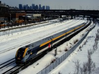 VIA 33 has its once a week Siemens consist as it passes the skyline of downtown Montreal.