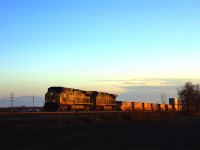 Originating on the CSX in Syracuse, N.Y., Canadian National Huntingdon-Montreal train M326 with AC4400CWs 506 and 316 on the point catches the dying light of day as it comes onto the Kingston Sub from the Valleyfield Sub
at CN Coteau-Est for the final 30 miles to Taschereau Yard.