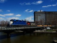 Ex-GMTX CN 4903 & CN 4115 lead a transfer into the Port of Montreal. The water level at the eastern end of the Lachine Canal is quite high.