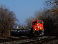 CN 527 is rounding a superelevated curve at MP 7 of CN's Montreal Sub after setting off cars on the Freight Track near Turcot Ouest.