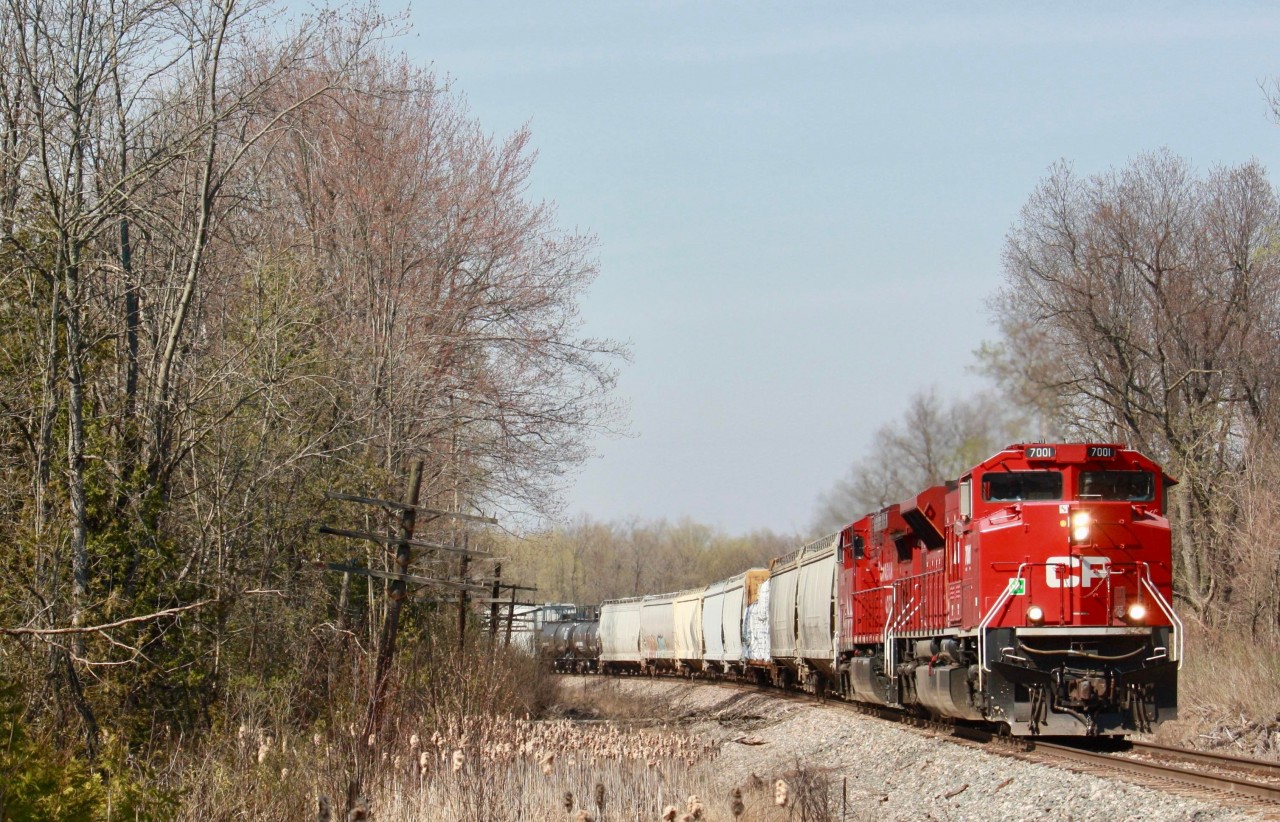 CP 238 heads down the Hamilton subdivision  on Sunday afternoon with CP SD70ACU 7001 leading.