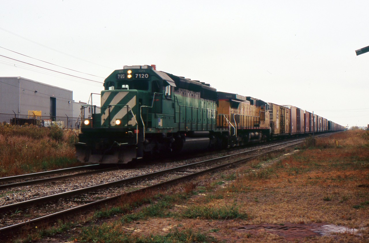 NS 328 with EX BN CEFX 7120 SD40-2 and UP C44-9W 9685 through St. Catharines on a Dull crapy day. Manage to get it as is with cloudy conditions.