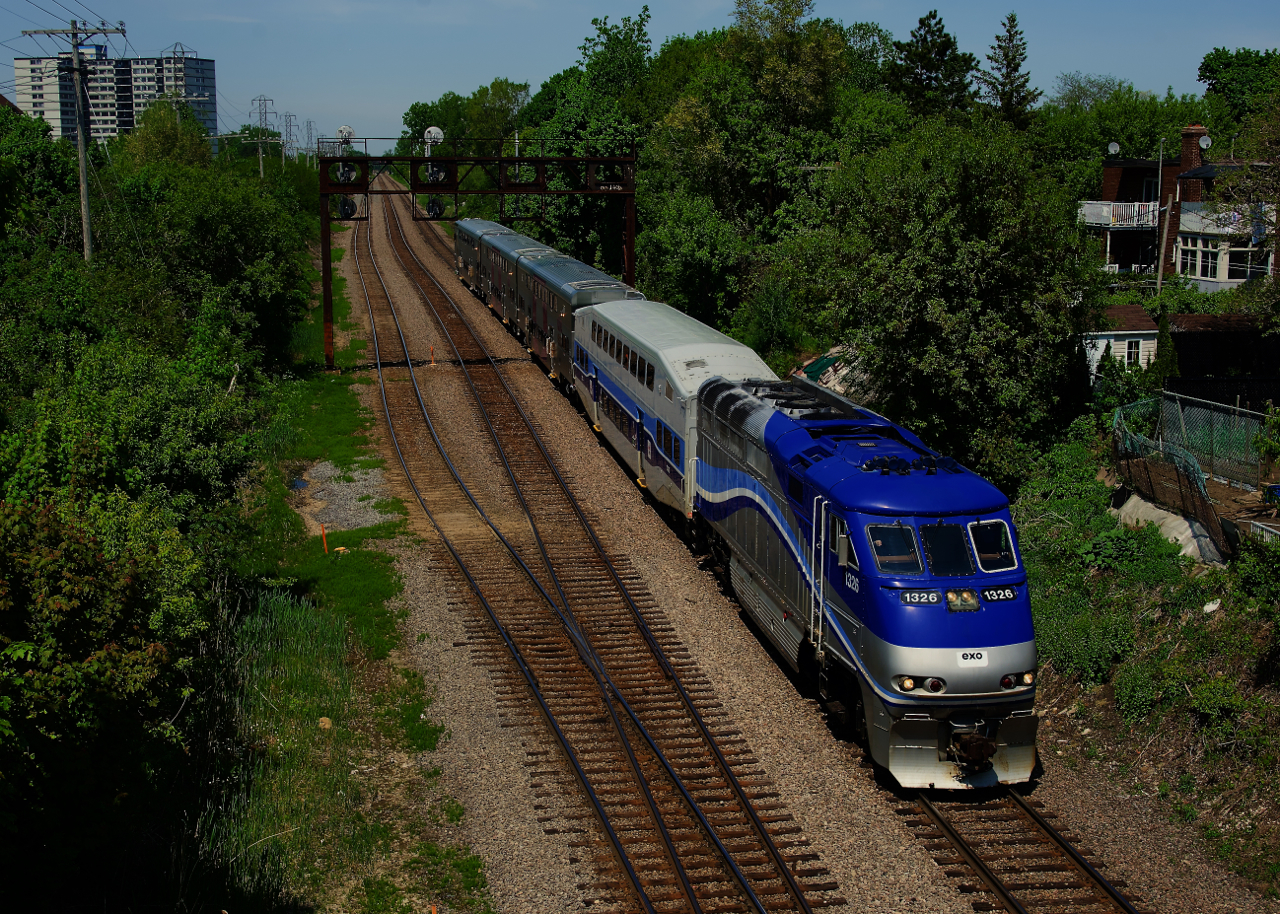 Test train EXO E172 has three new bilevel cars built by CRRC in tow as it prepares to take the North Jct Lead to reach the Westmount Sub.