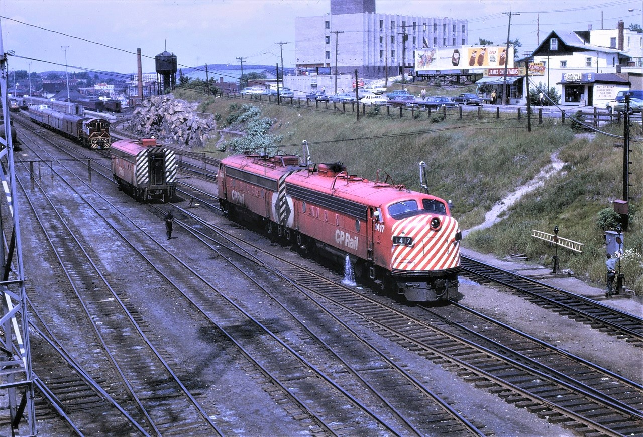 CP Sudbury was a very busy place when the eastbound Canadian arrived.  The "B" unit 1904 has been set off and the 1417 is taking on water.  The power for the Toronto section is making their way past the station.  The yard engine is busy switching cars.  A lot of action!!!