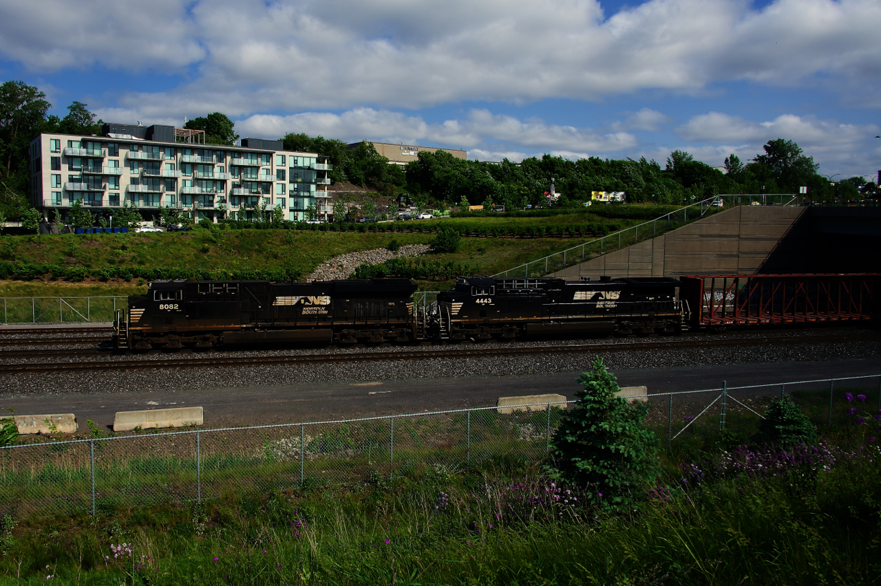 NS 8082 & NS 4443 lead a 78-car CN 529, heading towards its terminus of Taschereau Yard a few hours later than normal.