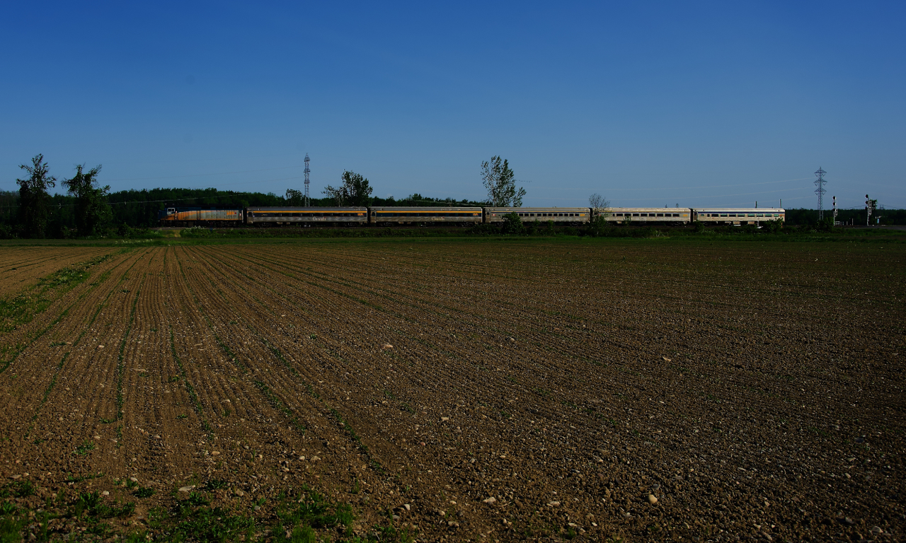 After stopping at nearby Coteau Station, VIA 28 is on the move again with VIA 6432 leading five HEP cars.