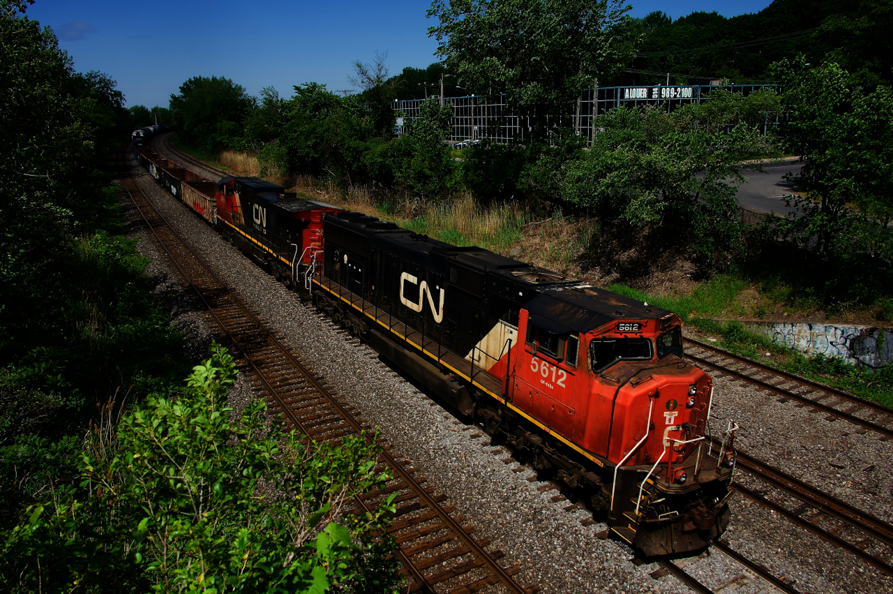 Now reduced to running three days a week (down from five), CN 324 has just left Taschereau Yard and is on its way to Vermont, with CN 5612 & CN 2665 for power.