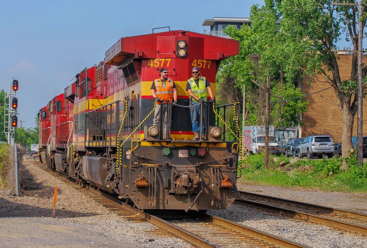 On June 12, 2023, CPKC's engines are returning from the port where they dropped off container cars. They are seen here crossing the Wilderton Street level crossing in LHF.