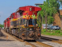 On June 12, 2023, CPKC's engines are returning from the port where they dropped off container cars. They are seen here crossing the Wilderton Street level crossing in LHF.