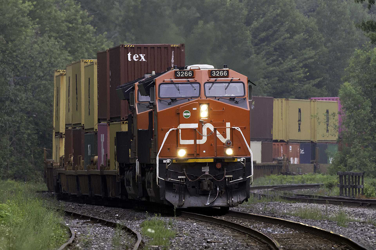 Southbound stacks about to pass under Highway 11. Washago is still a great place to watch the world go by.