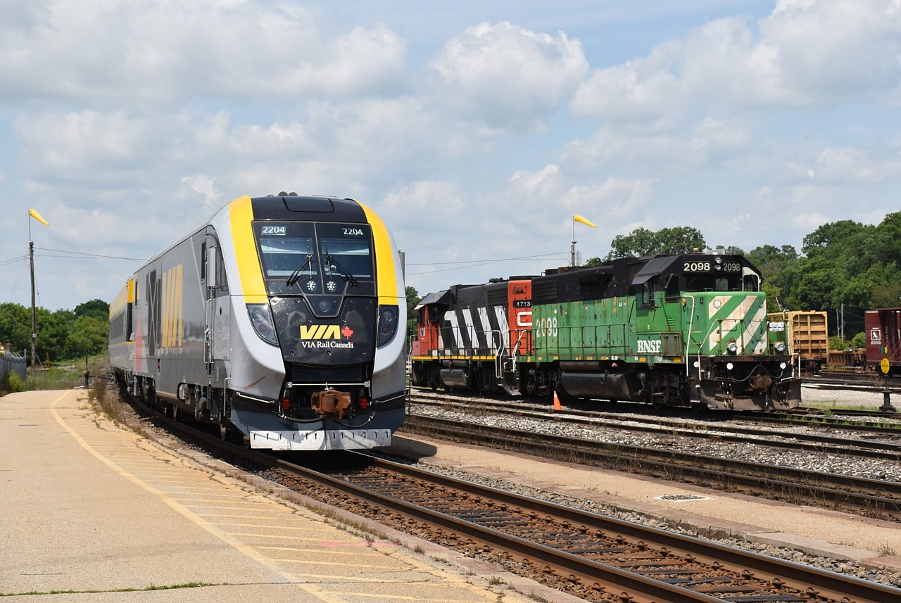 VIA / SIXX test train with new Siemens equipment slows for a brief station stop in Brantford, passing the most photographed locomotive in southern Ontario.  BNSF 2098 has been assigned to Brantford for over a month, and has attracted a lot of attention from the local railfan population.  CN 4713 is now paired with BNSF 2098, replacing CN 9547.