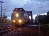 As it comes off the bridge over the Delisle River to start up the Alexandria Sub to Ottawa VIA F40PH-3 6426 and its trailing LRC coaches(and any and all in the vicinity...) are caught in the drenching rain and half-light of an unfortunately timed summer shower.