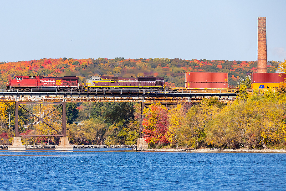 A late morning westbound crosses the Trent River with CP 8051 and 7018 on the front end.