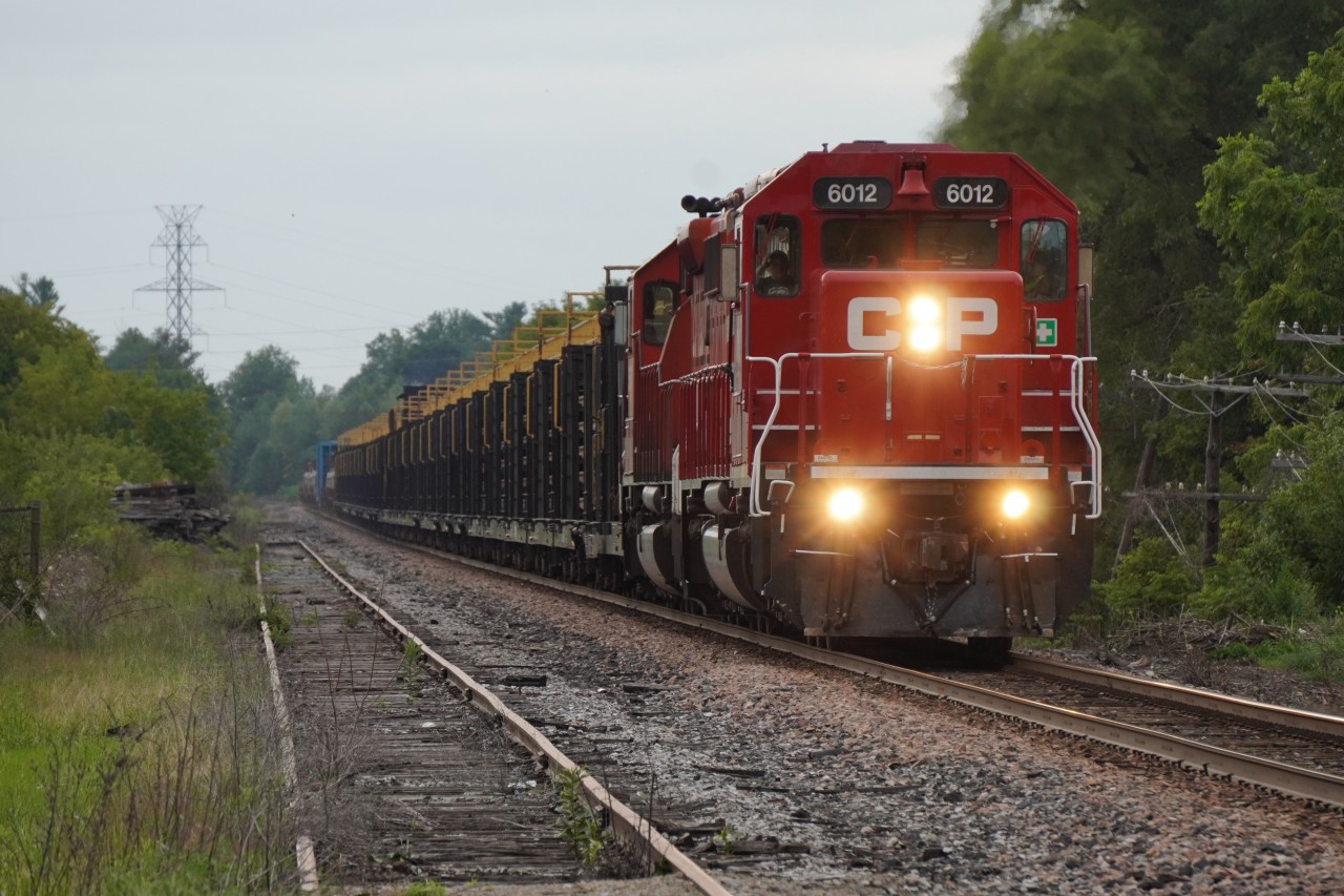 After meeting CPKC 421 at Baxter, CPKC CWR-07 heads down the Mactier before backing into Lambton to drop off cars on its tail end.