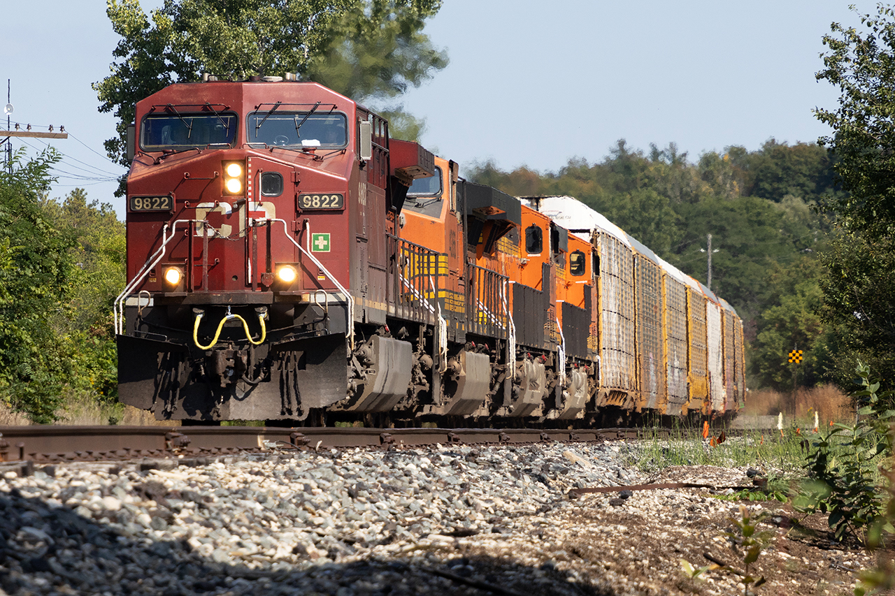 Fall colours. BNSF's 4366, 6840. 4250 trail as 137 flies into Galt.  This and 134 are the only normal day trains on the Galt. I wonder how Keith would respond to a phone call asking that 134 be held in London until 1 hour before sunrise, and 137 ordered for departure in Toronto for 2.5 hours before sunset? Just for better lighting, and less heat haze. They'd respond well to that, wouldn't they? :)