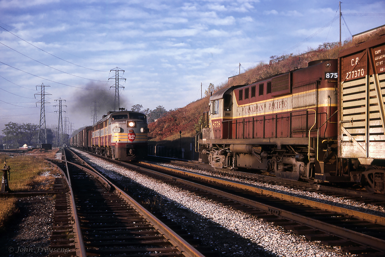 At the west end of Leaside yard, RS10 8758 is clear of the main waiting for an eastbound timetable freight headed to Smith Falls before proceeding west to Lambton Yard.Shortly after this shot, the Budd cars from Havelock will pass by just down the hill from this scene.Scan and editing by Jacob Patterson.