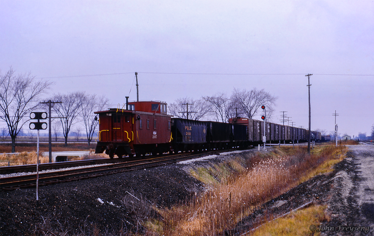 Wooden van N&W 2607 brings up the rear of this westbound CN extra at Canfield Junction.  In lieu of the former mixed train which ran from St. Thomas to Jarvis and return, CN operated an extra from Fort Erie to St. Thomas, which may explain the CN power with the N&W van.Scan and editing by Jacob Patterson.