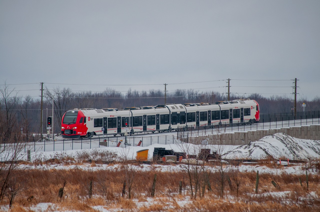 On January 26, 2024, O-Train train C11 departs from Limebank Station to Greenboro.