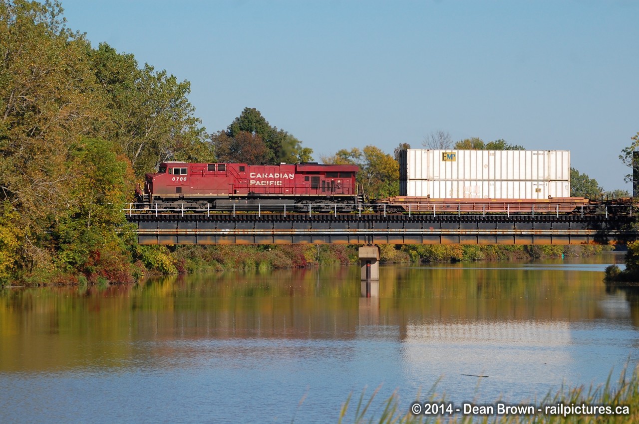 CP 142 with CP ES44AC 8786 crosses the Welland River on a sunny warm late afternoon in Sept of 2014.