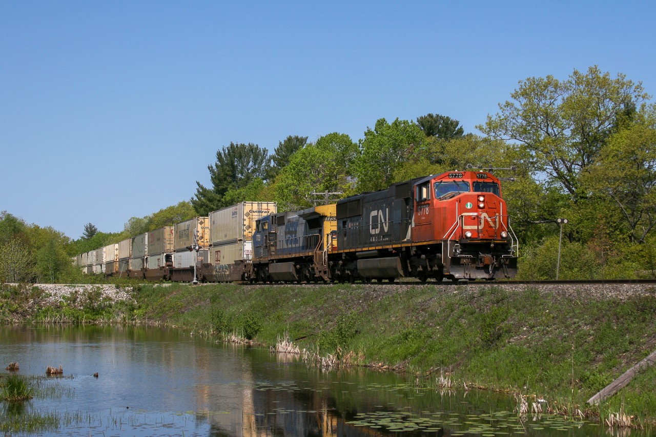 CN Q 11441 21 highballs through Sparrow Lake with CN 5778 and GECX 7733.